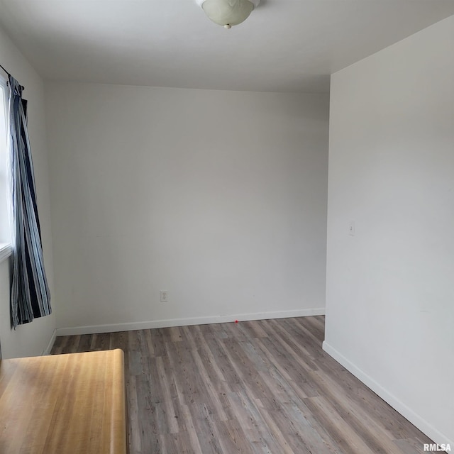 spare room with light hardwood / wood-style floors