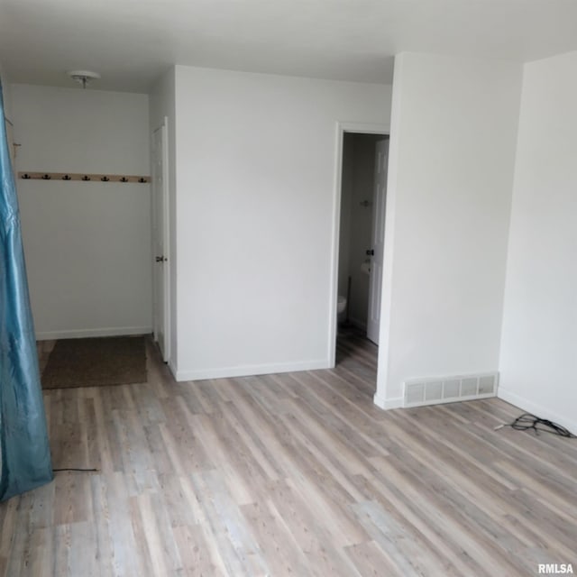 unfurnished room with light hardwood / wood-style flooring