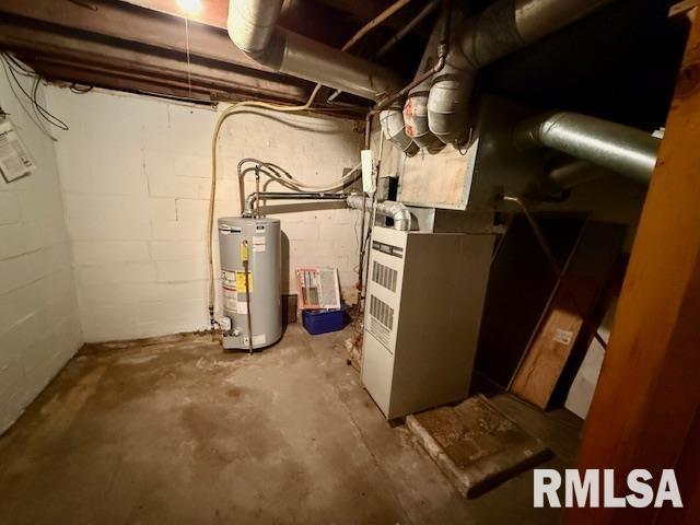 utility room featuring gas water heater