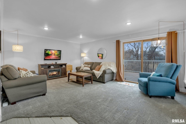 carpeted living room featuring ornamental molding