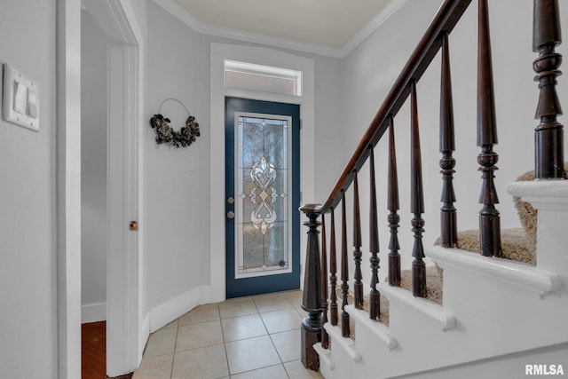 tiled foyer with ornamental molding