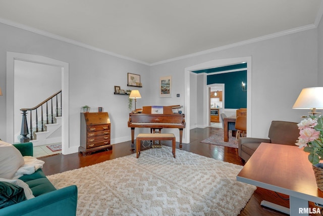 living room featuring ornamental molding and dark hardwood / wood-style floors