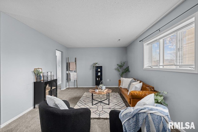 living room featuring light carpet and a textured ceiling