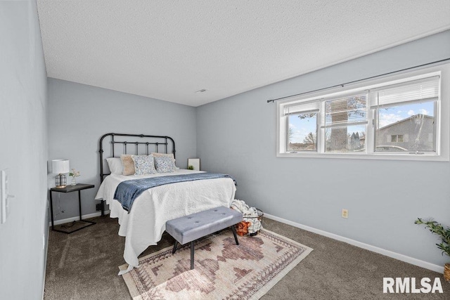 bedroom featuring carpet and a textured ceiling