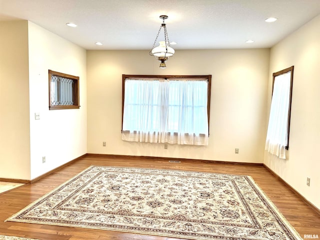 empty room featuring wood-type flooring