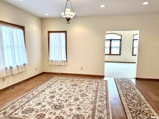 unfurnished room featuring wood-type flooring