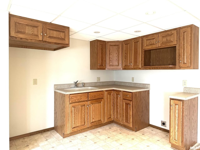 kitchen with sink and a paneled ceiling