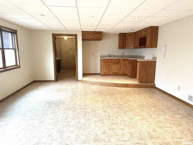 kitchen featuring sink and a drop ceiling