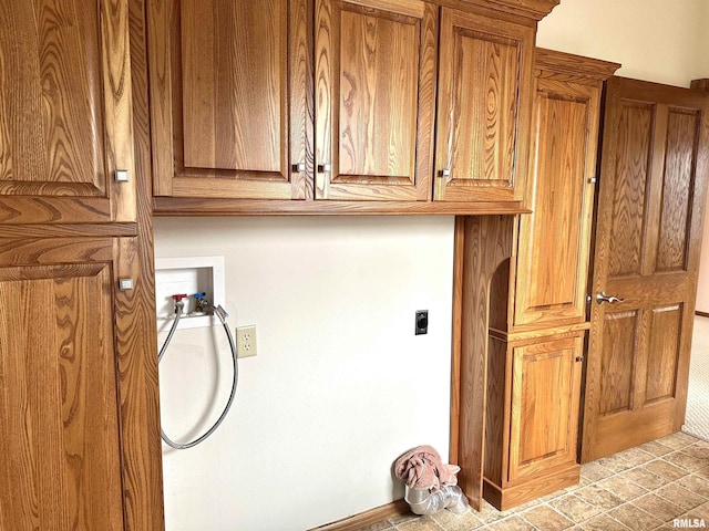 laundry room featuring cabinets, hookup for a washing machine, and hookup for an electric dryer