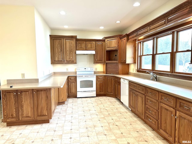 kitchen with sink and white appliances