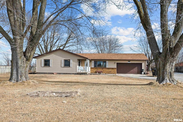 ranch-style home featuring a garage