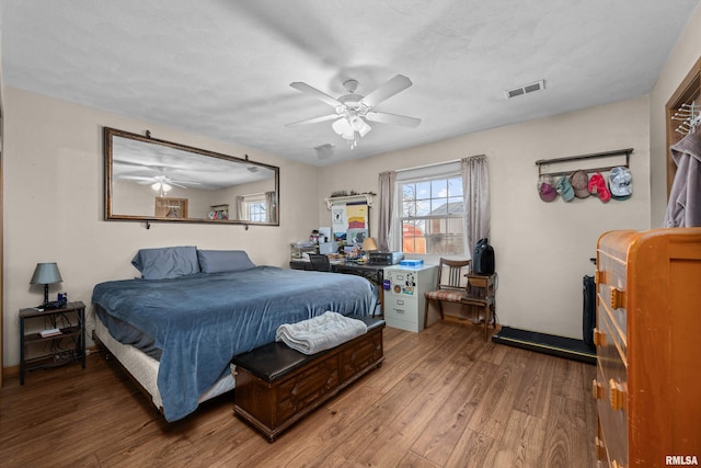 bedroom featuring hardwood / wood-style floors and ceiling fan