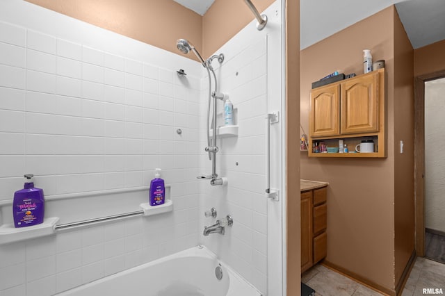 bathroom with tiled shower / bath combo and tile patterned floors