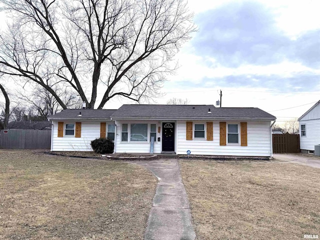 ranch-style house with central AC unit and a front lawn