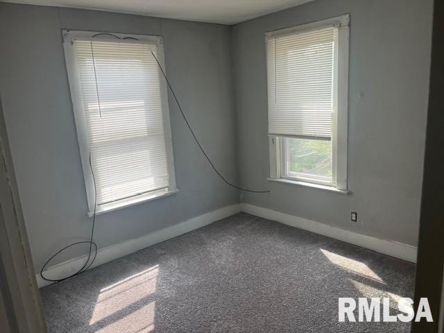 1015 Arlington Ct, Davenport, IA 52803 - carpeted empty room featuring baseboards