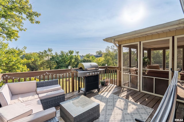 wooden deck with a grill and an outdoor hangout area