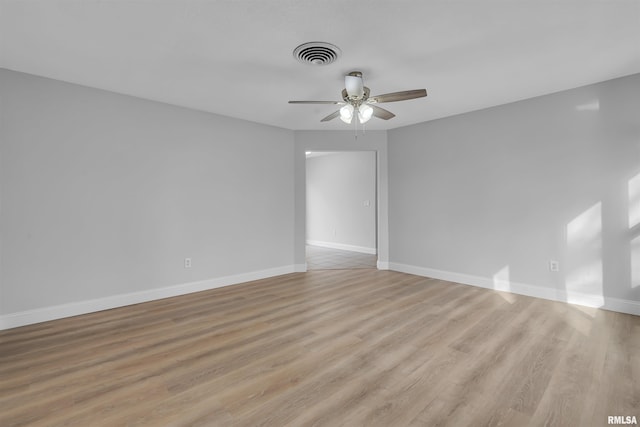 empty room with ceiling fan and light wood-type flooring