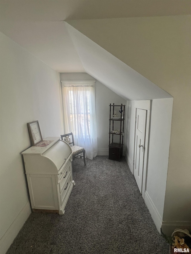 bonus room with carpet floors, baseboards, and vaulted ceiling