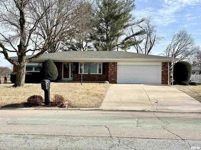 single story home with a garage