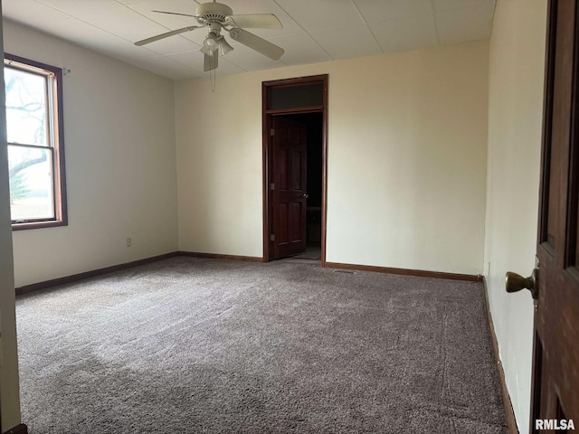 carpeted empty room with ceiling fan