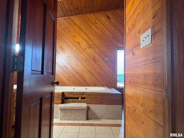 interior space with light tile patterned flooring, wooden ceiling, and wood walls