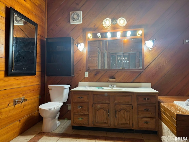 bathroom with vanity, tile patterned floors, and wooden walls