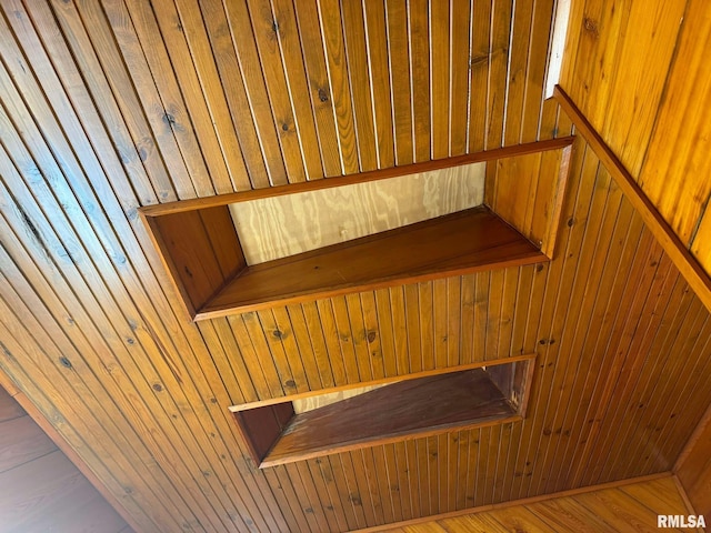 staircase with wood walls