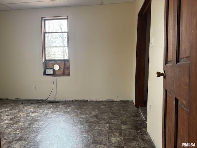 spare room featuring a drop ceiling