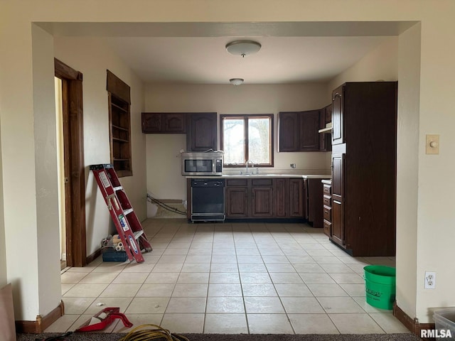 kitchen with dark brown cabinetry, dishwasher, sink, and light tile patterned floors