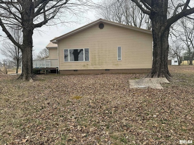 view of side of home featuring a deck