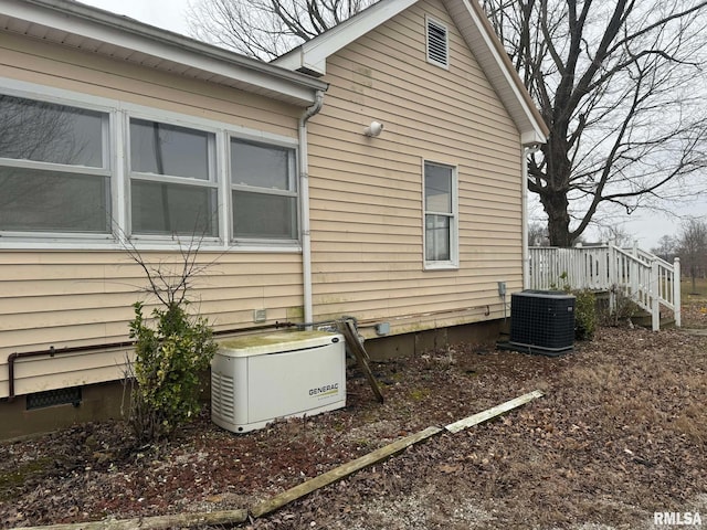 view of side of property with central AC