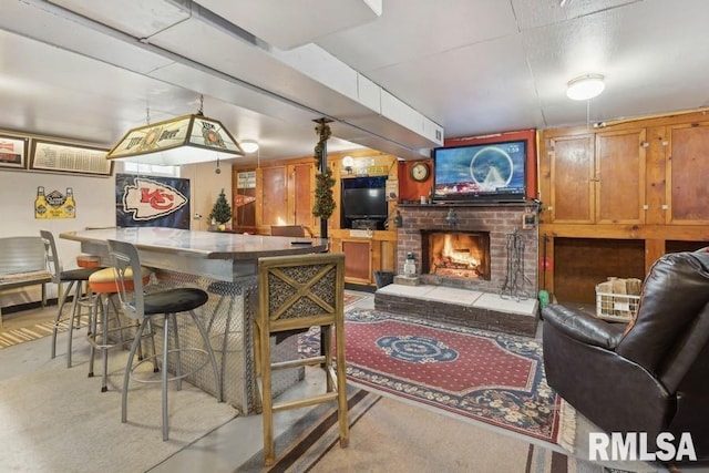 bar featuring decorative light fixtures and a fireplace