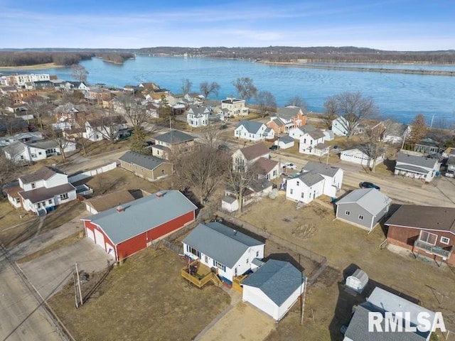 birds eye view of property with a water view and a residential view