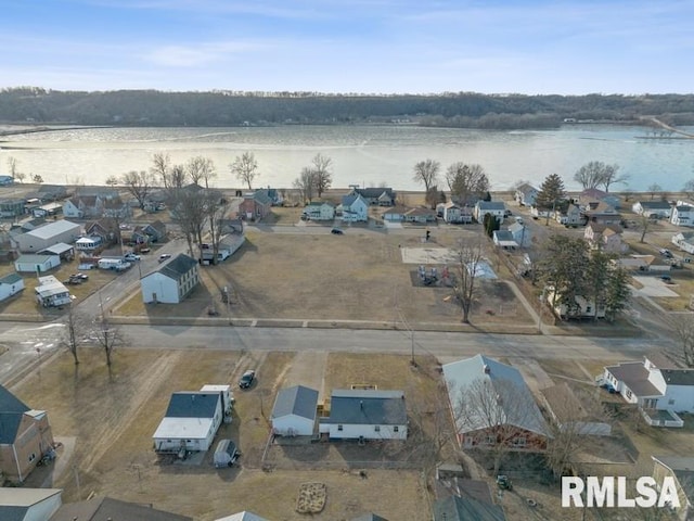 birds eye view of property with a residential view and a water view