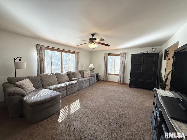 living room featuring plenty of natural light, ceiling fan, and carpet floors