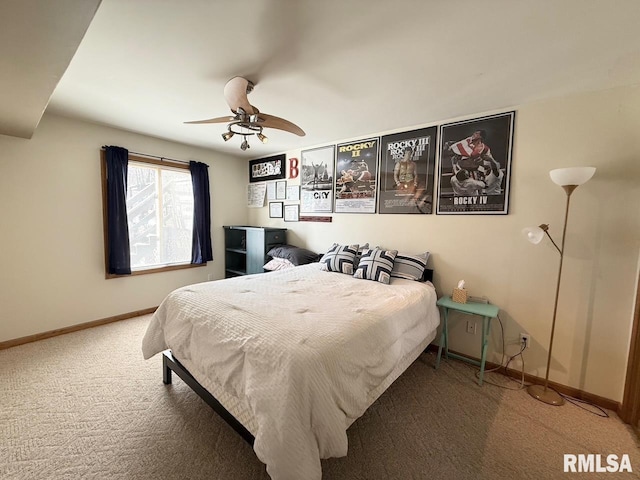 bedroom featuring a ceiling fan, carpet, and baseboards