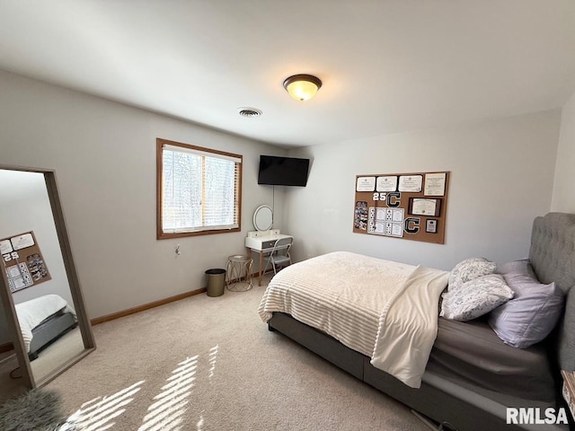 bedroom featuring visible vents, baseboards, and carpet floors