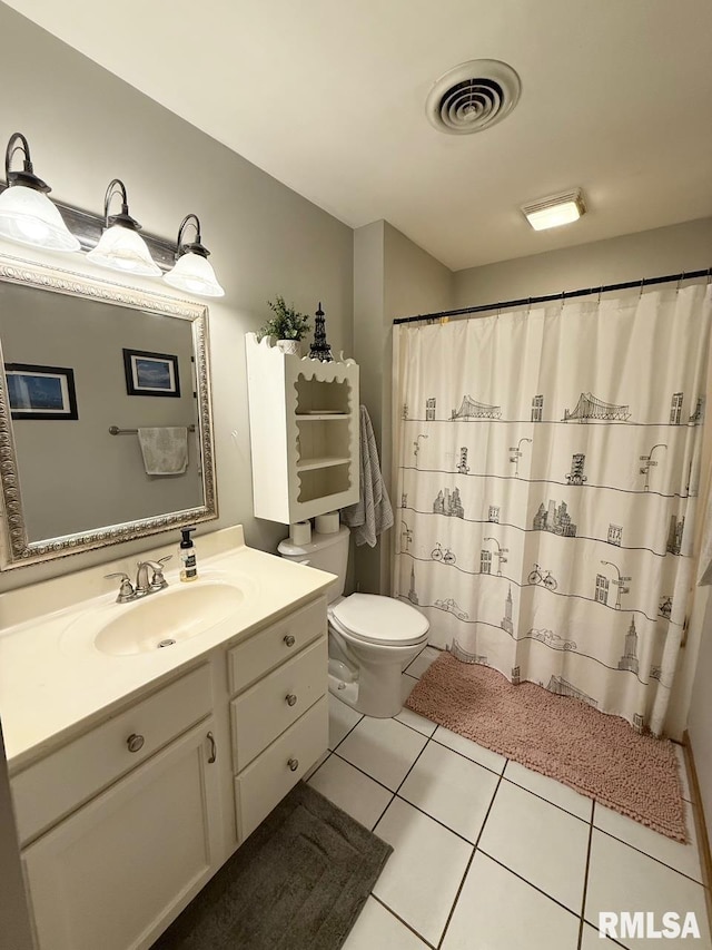 bathroom with tile patterned flooring, visible vents, curtained shower, toilet, and vanity