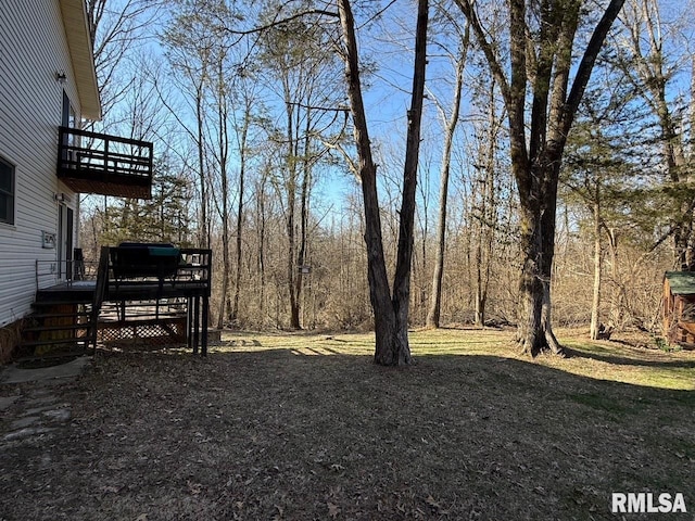 view of yard with a wooden deck