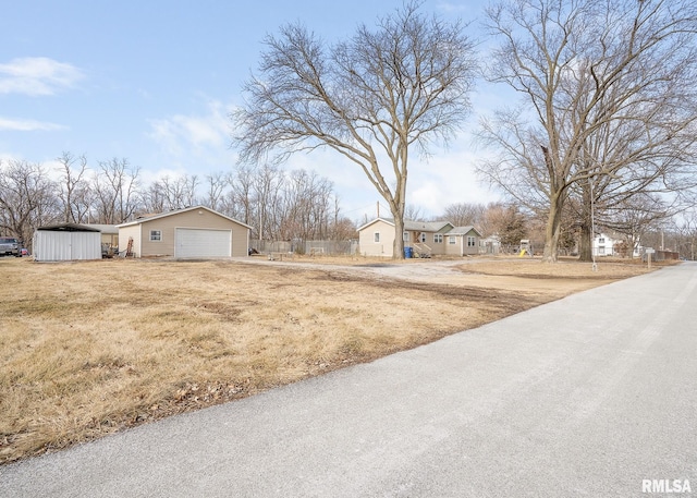 view of yard with a garage and an outdoor structure