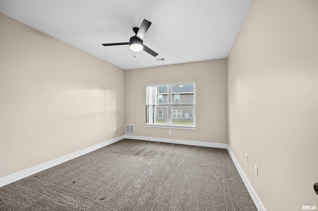 spare room featuring ceiling fan and carpet flooring