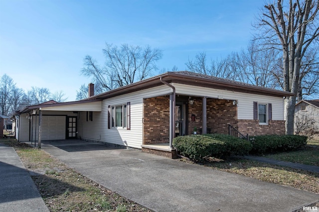 ranch-style home with a garage, brick siding, driveway, and a chimney