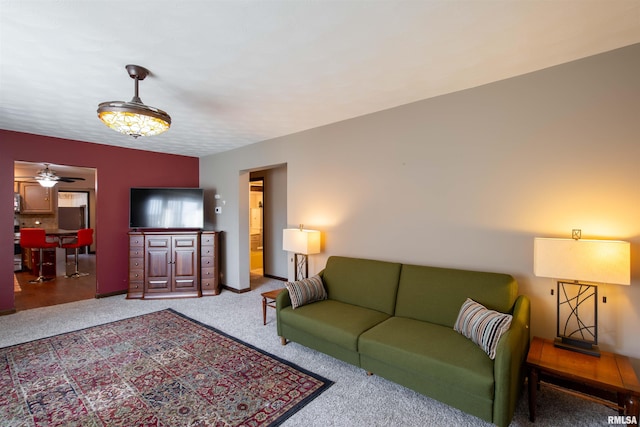 living room with carpet flooring and ceiling fan