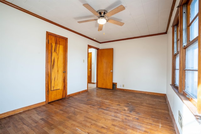 spare room featuring ornamental molding, hardwood / wood-style floors, and ceiling fan