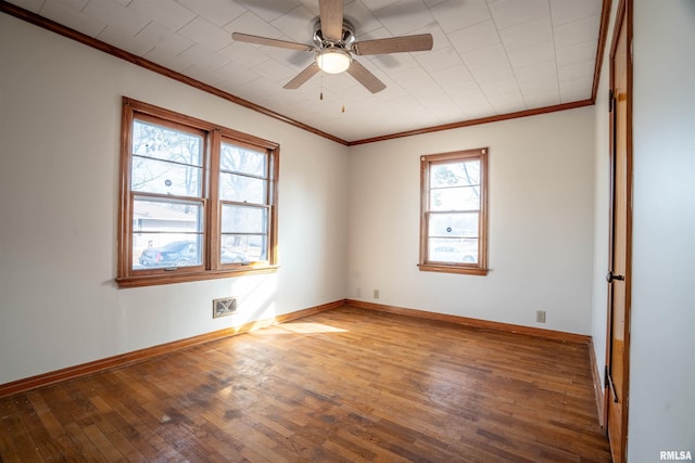 spare room with wood-type flooring, ornamental molding, and ceiling fan