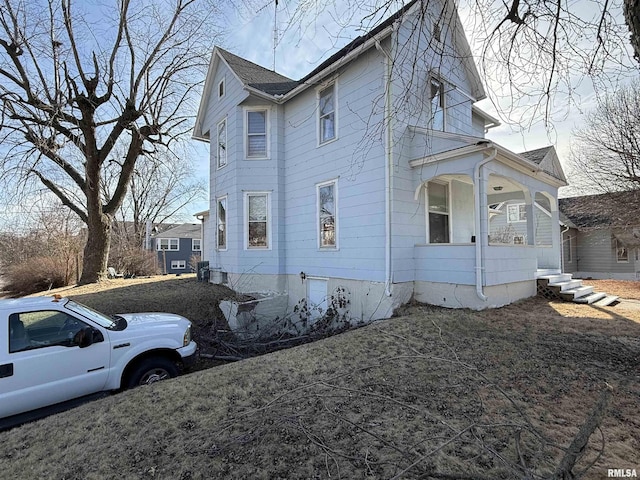 view of home's exterior featuring covered porch