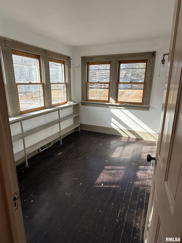 empty room featuring dark hardwood / wood-style flooring