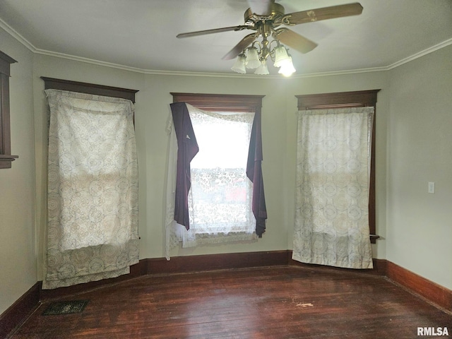 620 Sycamore St, Muscatine, IA 52761 - spare room featuring wood finished floors, visible vents, and ornamental molding