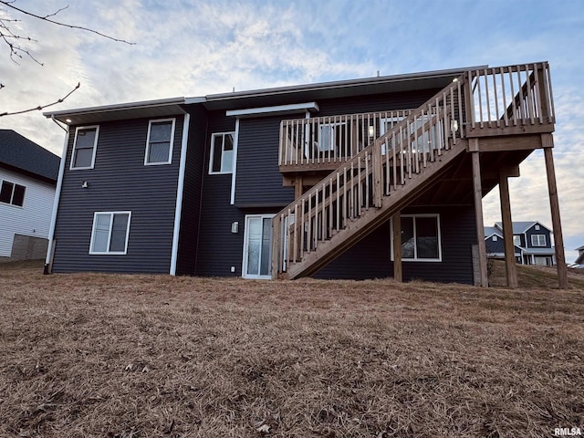 back of property featuring a deck