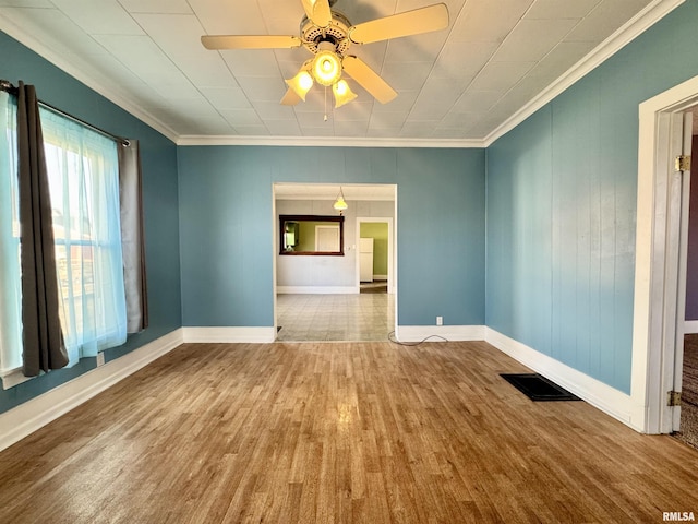 unfurnished room featuring hardwood / wood-style flooring, crown molding, and ceiling fan